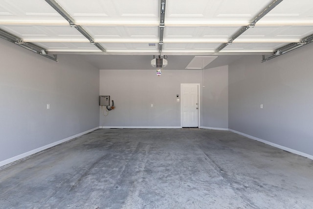 1435 Vine St, Weatherford, TX 76086 - garage featuring a garage door opener and baseboards