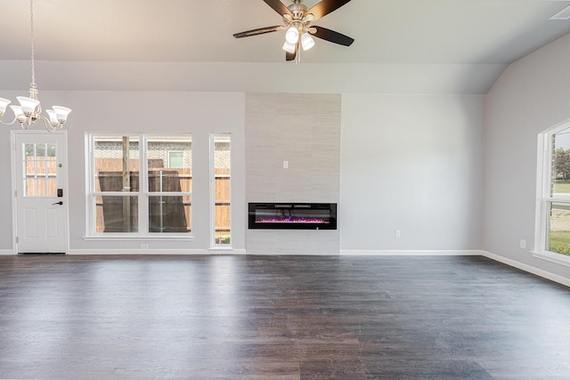 1435 Vine St, Weatherford, TX 76086 - unfurnished living room featuring dark wood-style flooring, a chandelier, a ceiling fan, vaulted ceiling, and a fireplace