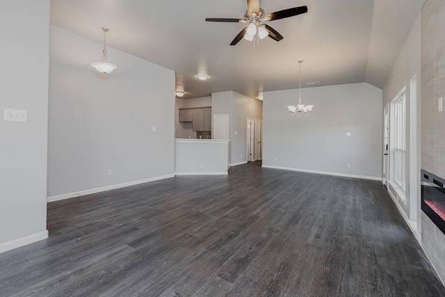 1435 Vine St, Weatherford, TX 76086 - unfurnished living room featuring a ceiling fan, a chandelier, dark wood-type flooring, and lofted ceiling