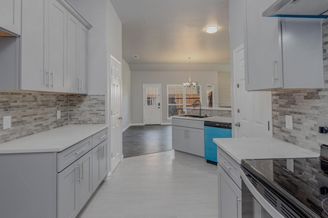 1435 Vine St, Weatherford, TX 76086 - kitchen with electric range oven, dishwashing machine, a chandelier, and decorative backsplash