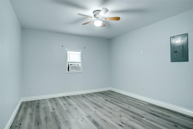 1410 W Torrey St, Granbury, TX 76048 - empty room with electric panel, wood finished floors, baseboards, ceiling fan, and cooling unit