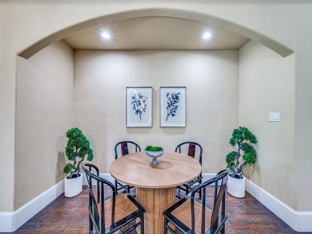 3917 W 6th St, Fort Worth, TX 76107 - dining area with arched walkways, recessed lighting, baseboards, and wood finished floors