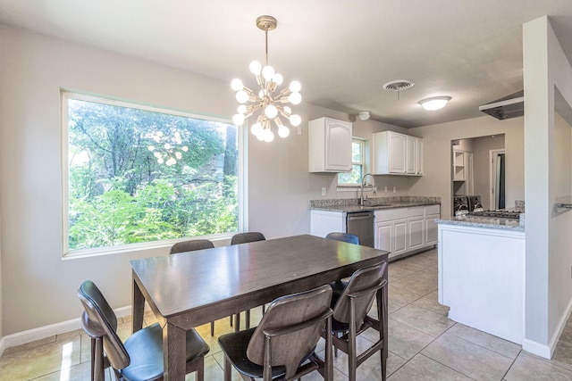 2218 Archer Trl, Denton, TX 76209 - dining room with baseboards, light tile patterned flooring, and a chandelier
