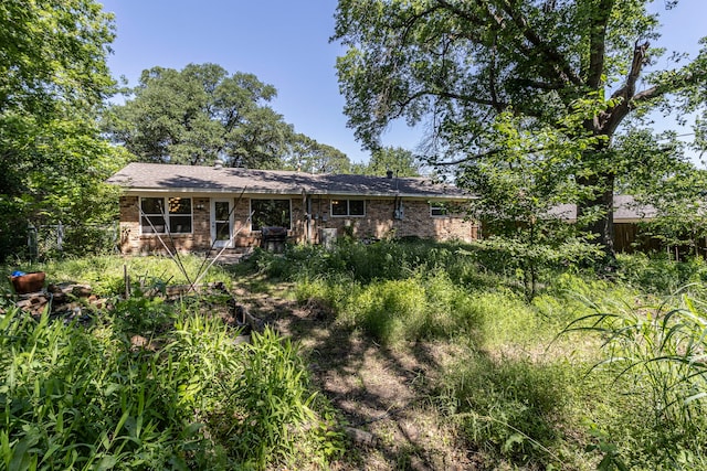 2218 Archer Trl, Denton, TX 76209 - rear view of property with fence and brick siding
