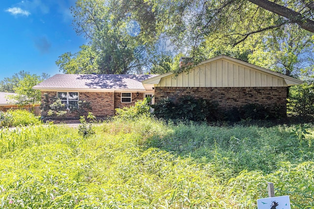 2218 Archer Trl, Denton, TX 76209 - view of side of property with brick siding and a chimney
