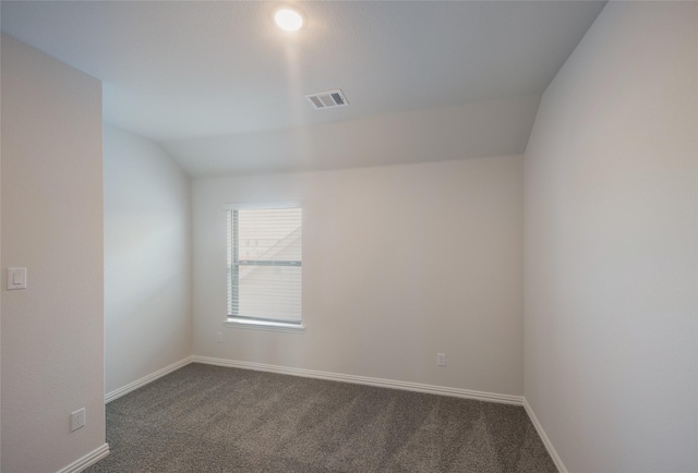4118 Beale St, Heartland, TX 75114 - spare room with dark colored carpet, baseboards, and lofted ceiling