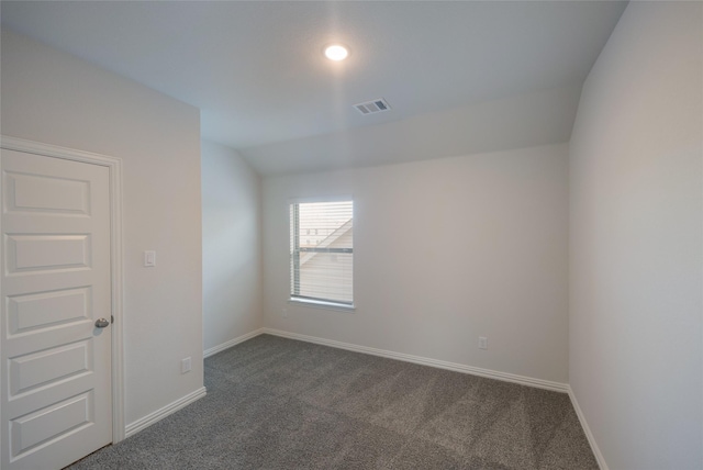 4118 Beale St, Heartland, TX 75114 - spare room featuring dark colored carpet, baseboards, and lofted ceiling