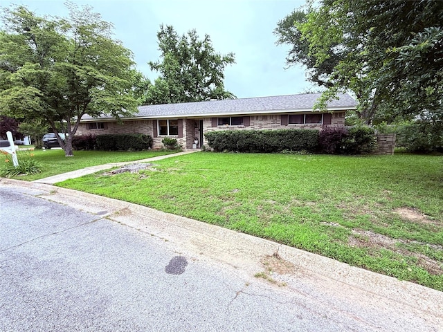 108 Martha Dr, Winnsboro, TX 75494 - ranch-style house with a front yard
