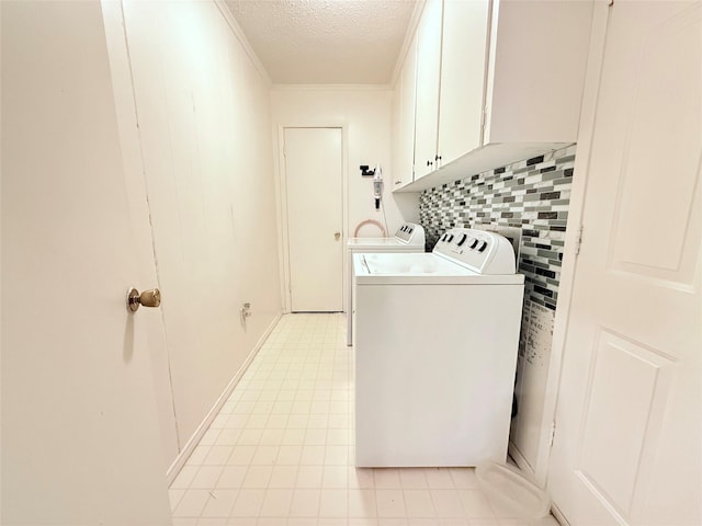 108 Martha Dr, Winnsboro, TX 75494 - laundry area with separate washer and dryer, cabinet space, a textured ceiling, light tile patterned flooring, and ornamental molding