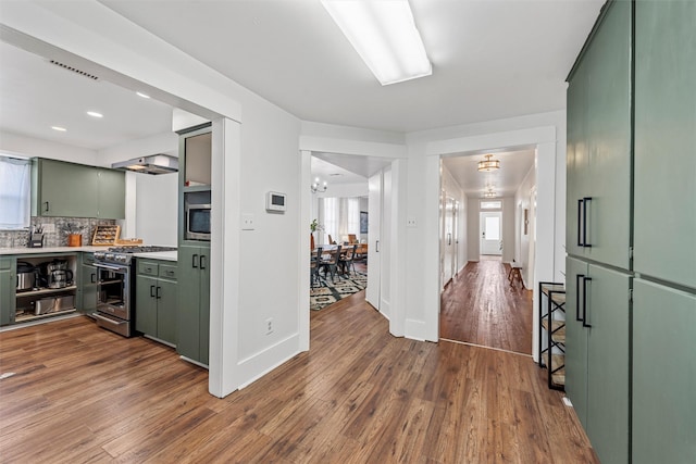 3801 Homan Ave, Waco, TX 76707 - hallway with dark wood-style flooring, a chandelier, baseboards, and recessed lighting