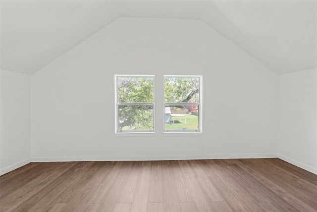 3801 Homan Ave, Waco, TX 76707 - additional living space with wood finished floors, vaulted ceiling, and baseboards