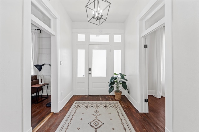 3801 Homan Ave, Waco, TX 76707 - foyer featuring dark wood-type flooring, baseboards, and a chandelier