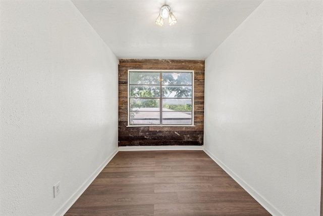 3801 Homan Ave, Waco, TX 76707 - unfurnished room with dark wood-style floors and baseboards
