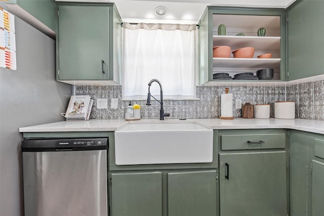 3801 Homan Ave, Waco, TX 76707 - kitchen with green cabinetry, stainless steel dishwasher, a sink, and decorative backsplash