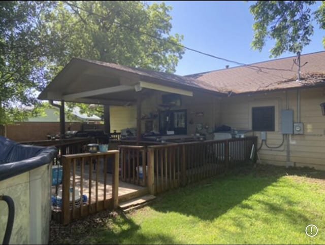 1106 Payne, Olney, TX 76374 - back of property with a wooden deck and a lawn