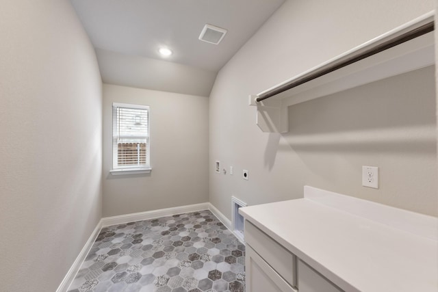 laundry room with hookup for an electric dryer, washer hookup, baseboards, gas dryer hookup, and cabinet space