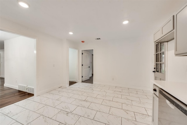 4900 S Drive, Fort Worth, TX 76132 - empty room with recessed lighting, baseboards, and light marble finish flooring