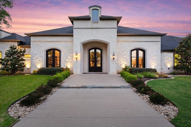 10031 Tumbling Trl, Waco, TX 76657 - entrance to property with french doors, a yard, and stucco siding