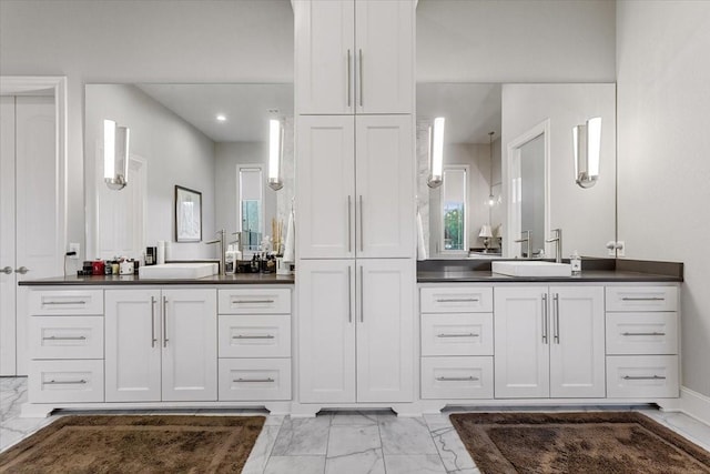 10031 Tumbling Trl, Waco, TX 76657 - full bathroom featuring marble finish floors, two vanities, and recessed lighting