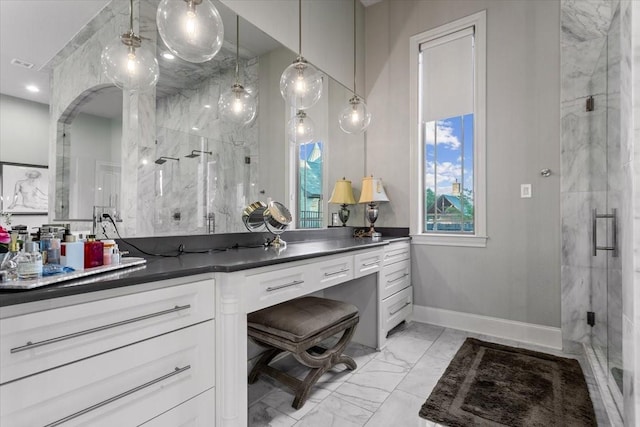 10031 Tumbling Trl, Waco, TX 76657 - full bath with marble finish flooring, a marble finish shower, vanity, and baseboards