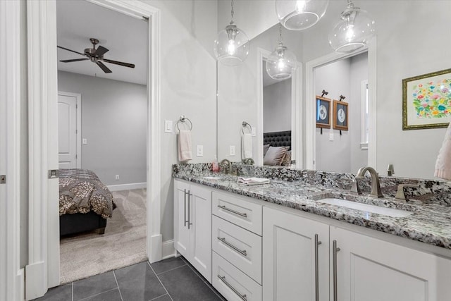 10031 Tumbling Trl, Waco, TX 76657 - ensuite bathroom with ceiling fan, tile patterned floors, double vanity, and baseboards