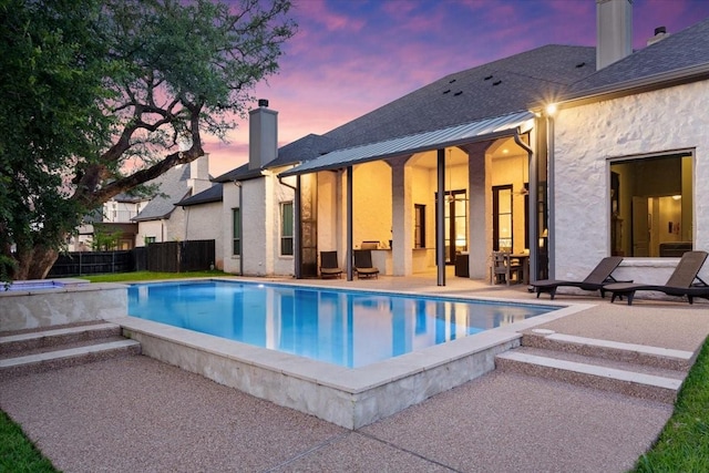 10031 Tumbling Trl, Waco, TX 76657 - pool at dusk featuring a patio area and fence
