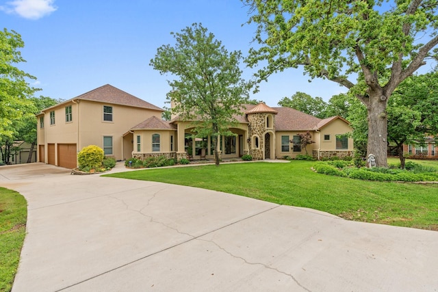 2051 E Oak Shores Dr, Cross Roads, TX 76227 - mediterranean / spanish-style home featuring stone siding, a garage, stucco siding, and concrete driveway