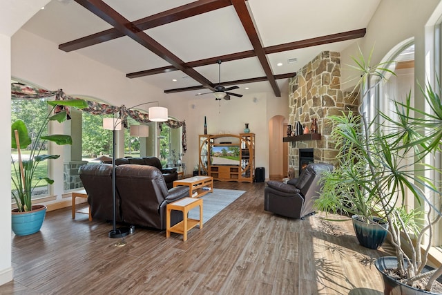 2051 E Oak Shores Dr, Cross Roads, TX 76227 - living area with ceiling fan, beamed ceiling, wood finished floors, a fireplace, and plenty of natural light