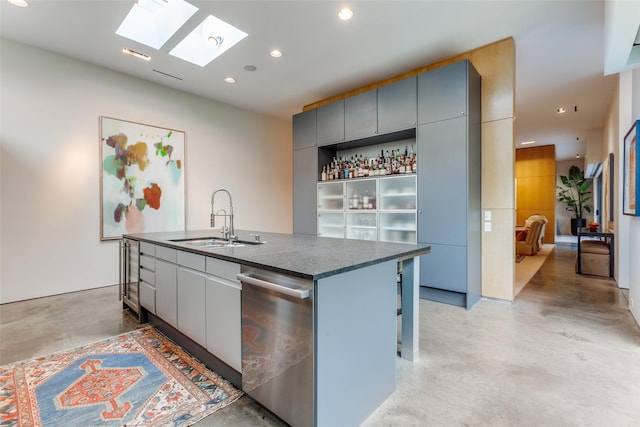 4335 Travis St, Dallas, TX 75205 - kitchen with dishwasher, a sink, finished concrete flooring, gray cabinets, and a skylight