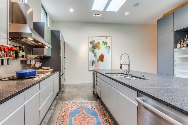 4335 Travis St, Dallas, TX 75205 - kitchen with appliances with stainless steel finishes, wall chimney range hood, a sink, a skylight, and open shelves