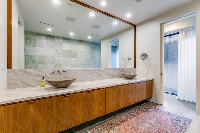 4335 Travis St, Dallas, TX 75205 - full bathroom featuring recessed lighting, double vanity, and tasteful backsplash