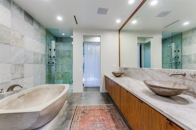 4335 Travis St, Dallas, TX 75205 - full bathroom with finished concrete flooring, a stall shower, recessed lighting, a freestanding bath, and double vanity