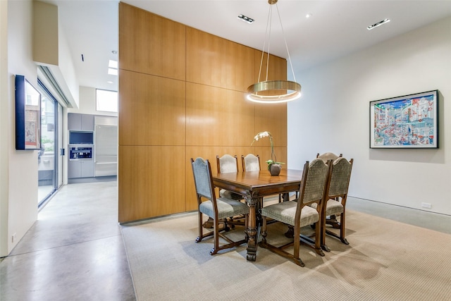 4335 Travis St, Dallas, TX 75205 - dining room featuring finished concrete floors