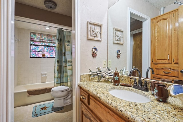 bathroom featuring toilet, a textured ceiling, tile patterned floors, shower / tub combo with curtain, and vanity