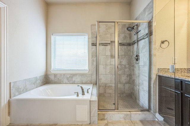 301 Harcourt Ave, Mckinney, TX 75072 - bathroom featuring a shower stall, a bath, and vanity