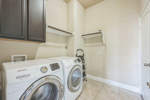 301 Harcourt Ave, Mckinney, TX 75072 - laundry area featuring cabinet space, washer and clothes dryer, baseboards, and light tile patterned floors