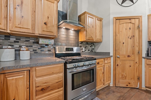 11240 County Road 102, Grandview, TX 76050 - kitchen with gas range, wall chimney exhaust hood, dark countertops, dark wood-style flooring, and backsplash