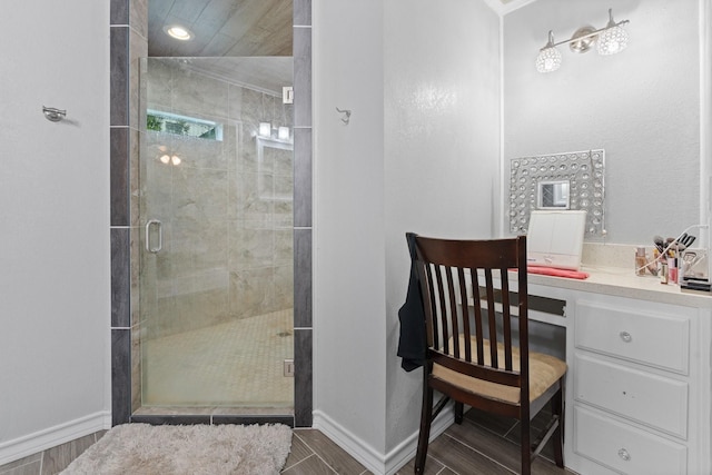 11240 County Road 102, Grandview, TX 76050 - bathroom featuring a stall shower, wood tiled floors, and baseboards