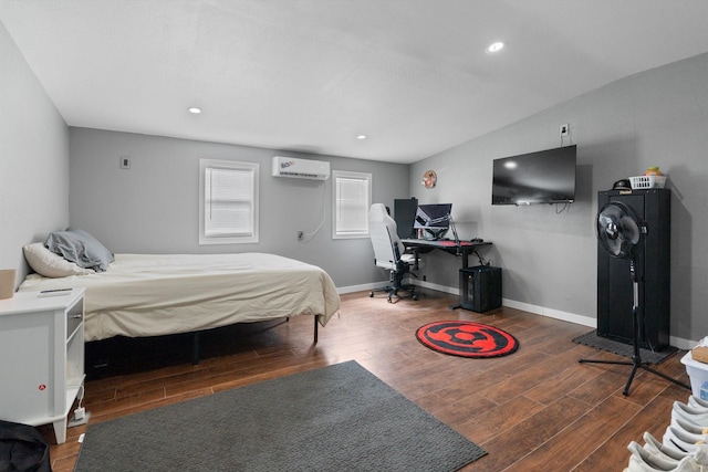 11240 County Road 102, Grandview, TX 76050 - bedroom with a wall mounted air conditioner, wood finished floors, baseboards, and recessed lighting
