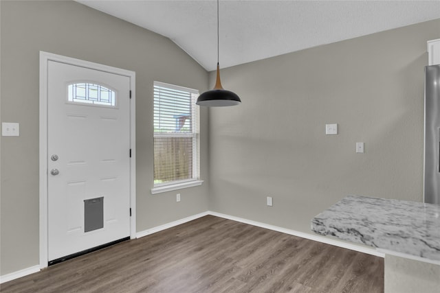 2532 Nogales Dr, Fort Worth, TX 76108 - foyer entrance featuring wood finished floors, vaulted ceiling, and baseboards