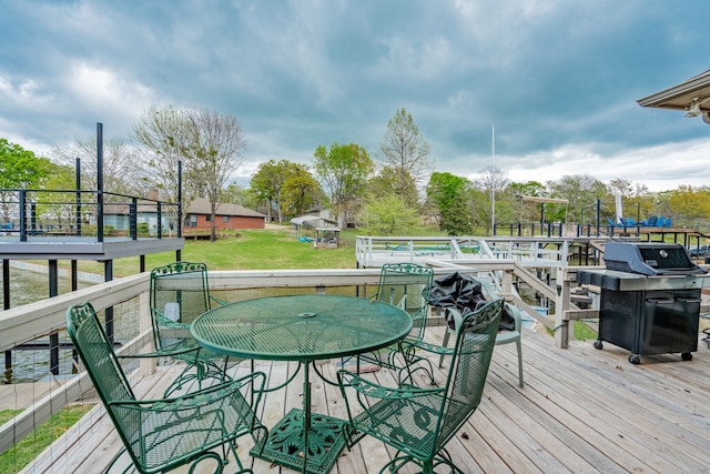 120 Saint Francis Ln, Mabank, TX 75156 - deck with a grill, a lawn, and outdoor dining area