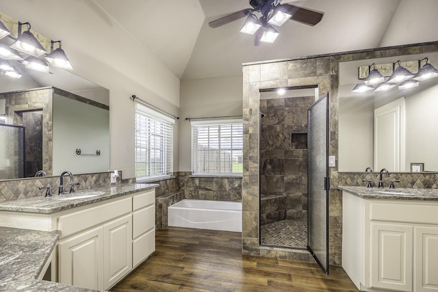 124 Fm 2450, Krum, TX 76249 - full bath with lofted ceiling, a ceiling fan, a stall shower, a garden tub, and two vanities