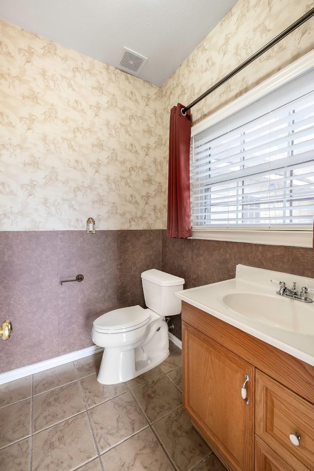 124 Fm 2450, Krum, TX 76249 - bathroom featuring wallpapered walls, toilet, and vanity