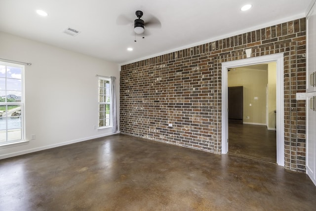 124 Fm 2450, Krum, TX 76249 - empty room featuring brick wall, concrete floors, a ceiling fan, baseboards, and recessed lighting