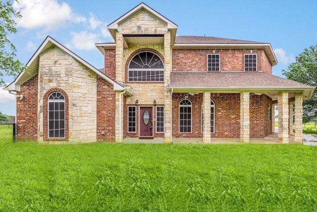 124 Fm 2450, Krum, TX 76249 - traditional-style home with stone siding, roof with shingles, and brick siding