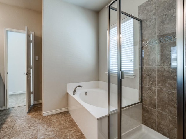 8808 Papa Trl, Mckinney, TX 75070 - full bath featuring a shower stall, a garden tub, and baseboards