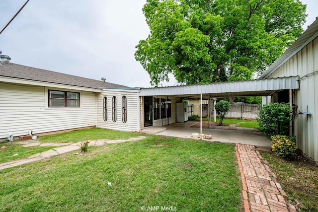 2302 13th, Brownwood, TX 76801 - back of property with a patio area