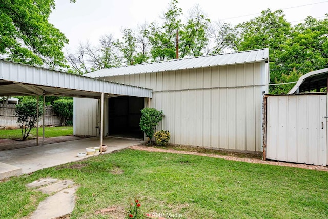 2302 13th, Brownwood, TX 76801 - view of outbuilding with a carport and an outbuilding