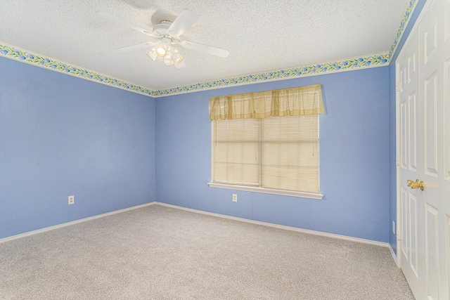 6204 Pennsylvania Ave, Arlington, TX 76017 - carpeted empty room with a textured ceiling and a ceiling fan
