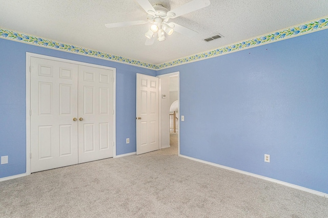 6204 Pennsylvania Ave, Arlington, TX 76017 - unfurnished bedroom featuring a closet, carpet flooring, a textured ceiling, and ceiling fan